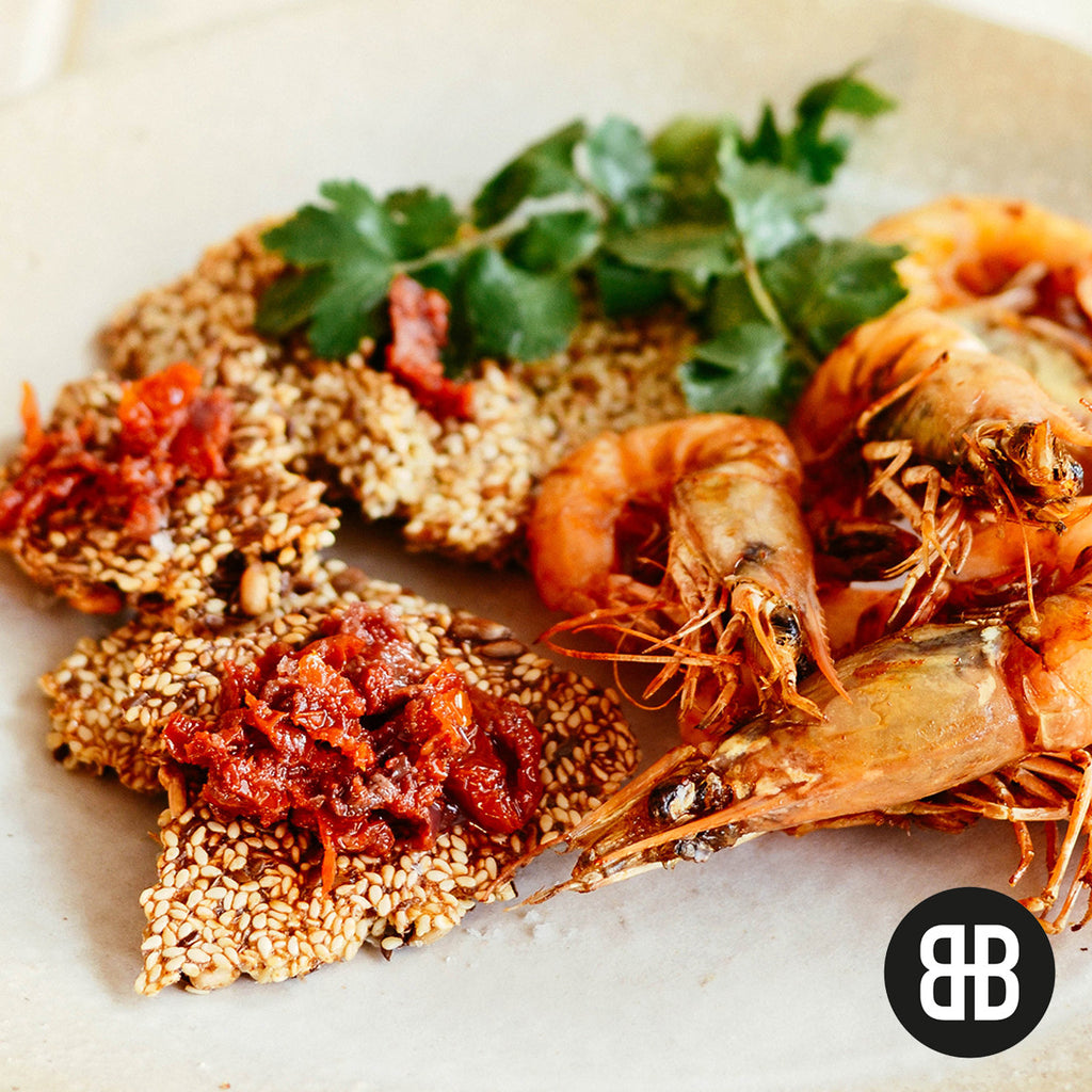 BANTING BLVD Seed Crackers with grilled coconut prawns and tomato tapenade